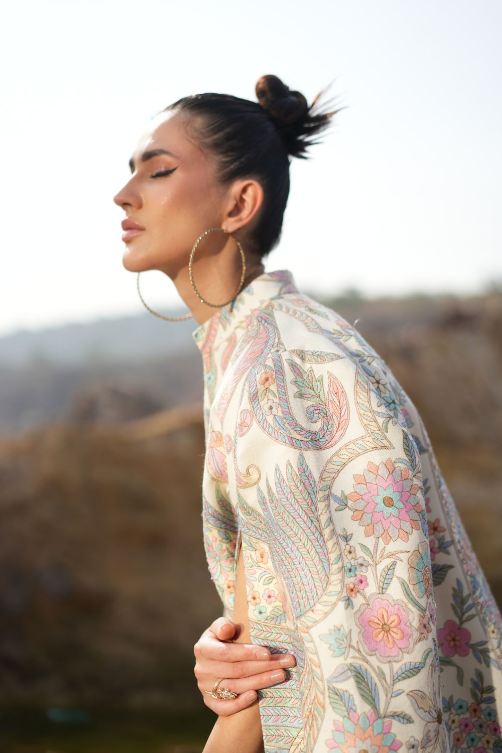 JOBAN SANDHU IN PAISLEY SWIRL CAPE