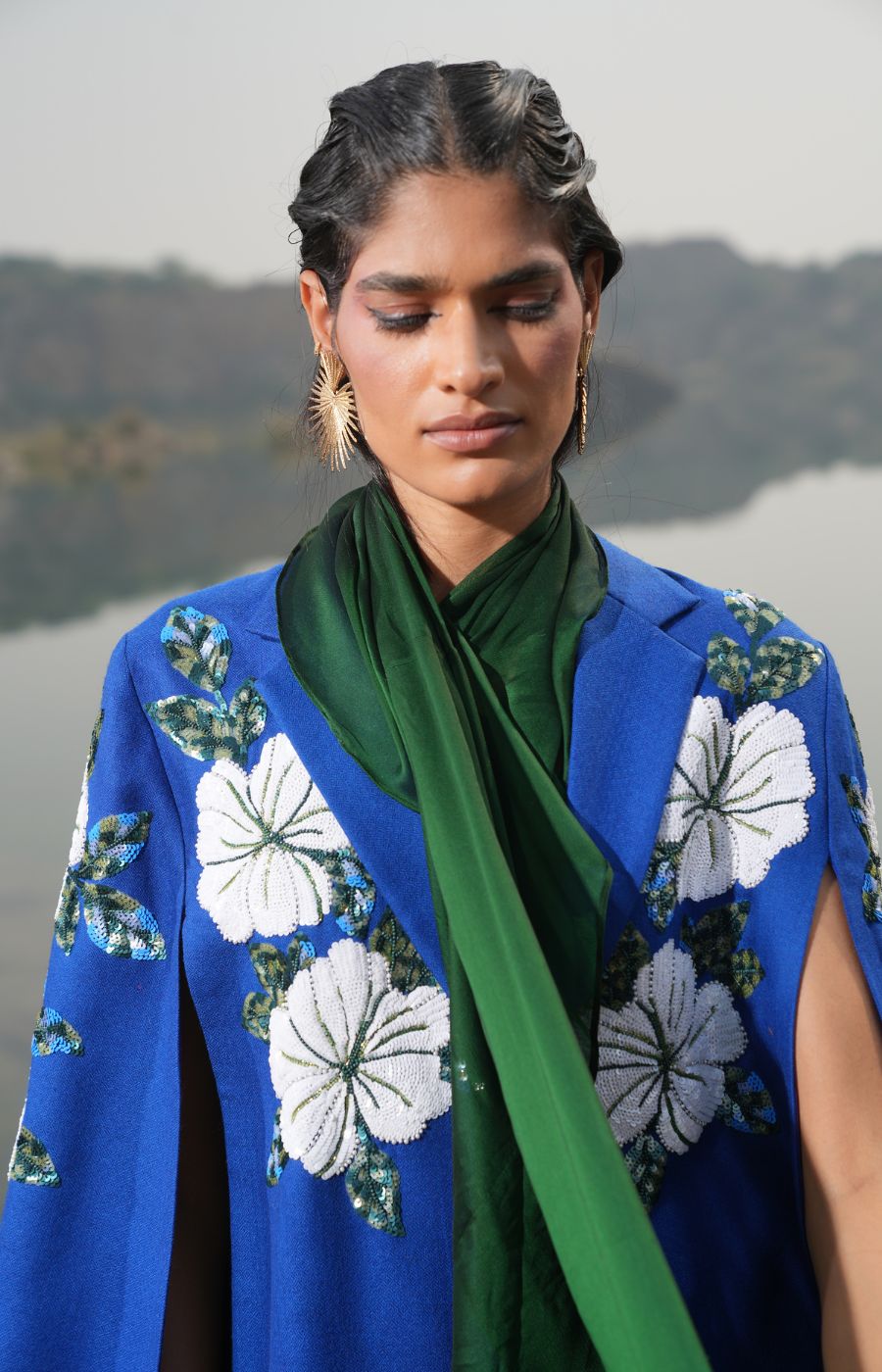 MEHAK BAKSHI IN WHITE FLORAL CAPE
